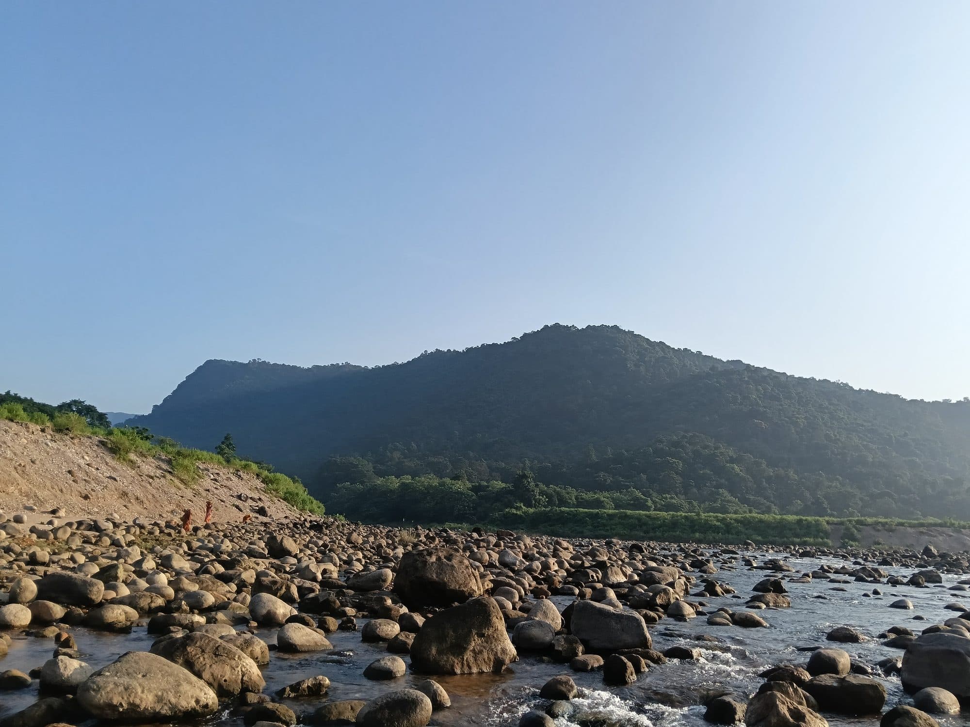 A rocky river valley below the border hills in Sylhet