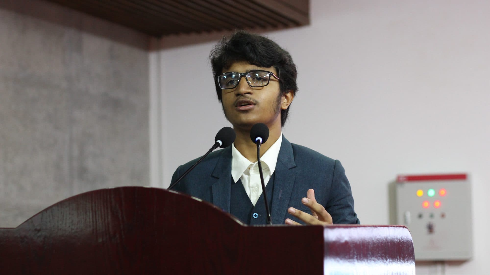 Mohammad Nasir speaking at a podium