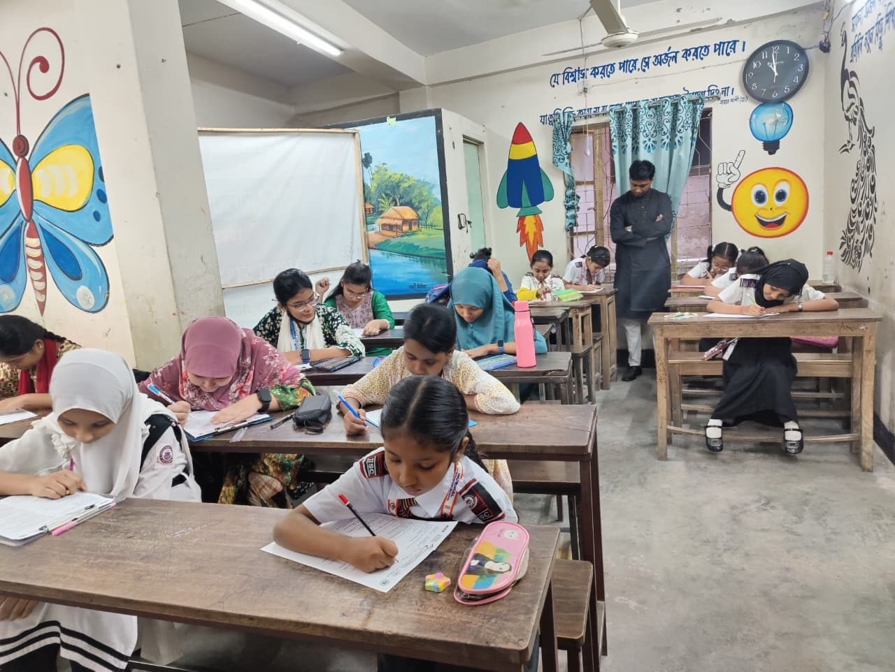 Young students taking the exam in a classroom