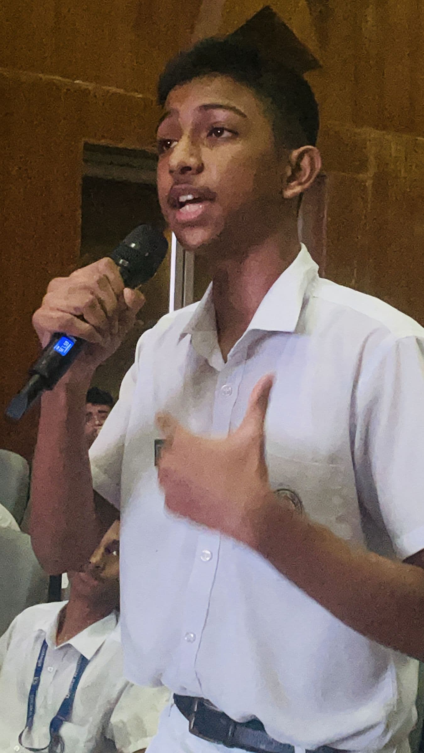 A student asking a question during a seminar
